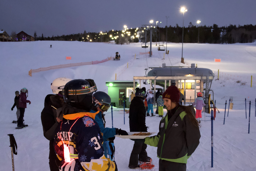 giving out cookies at night ski
