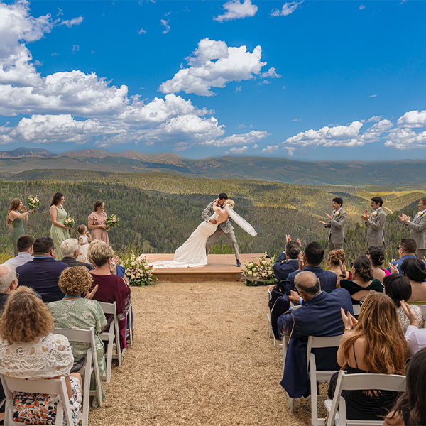 couple first kiss at wedding ceremony site
